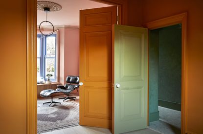 orange and green painted hallway 