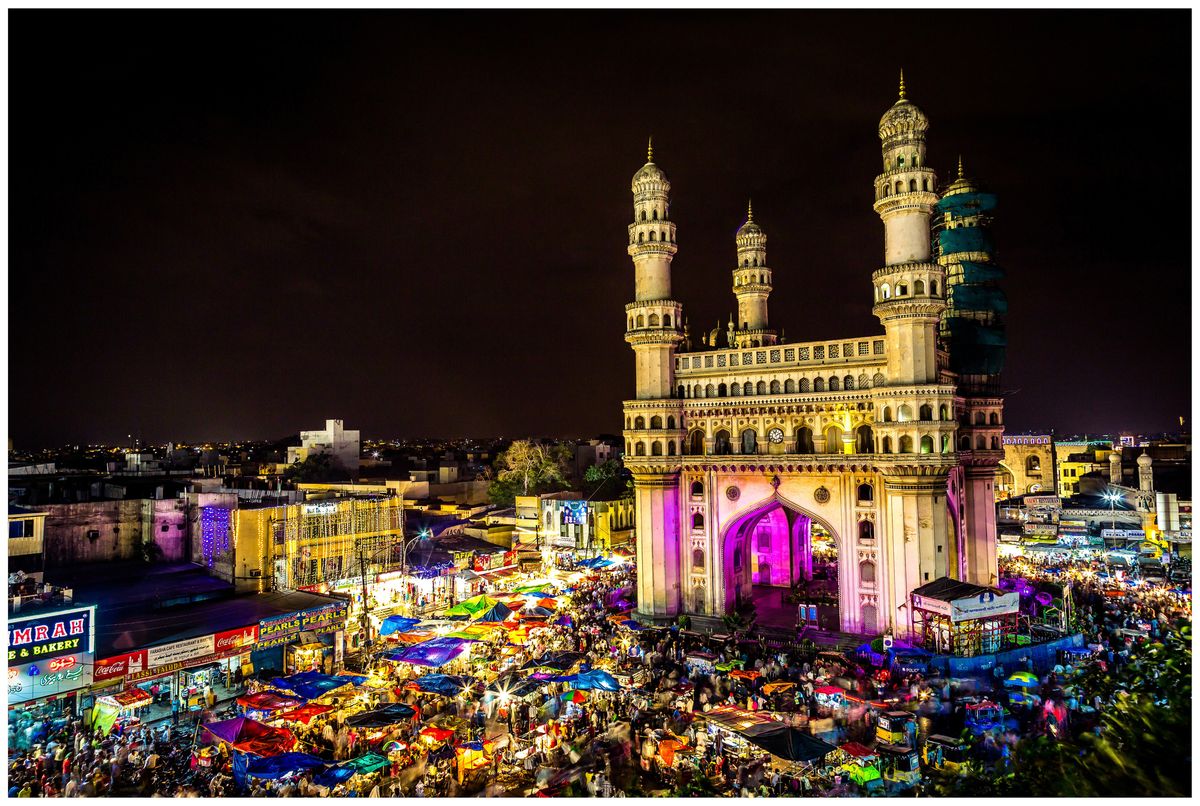 A high angle view of the Char Minar in Hyderabad amidst a night market