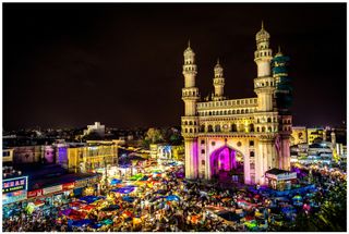 A high angle view of the Char Minar in Hyderabad amidst a night market