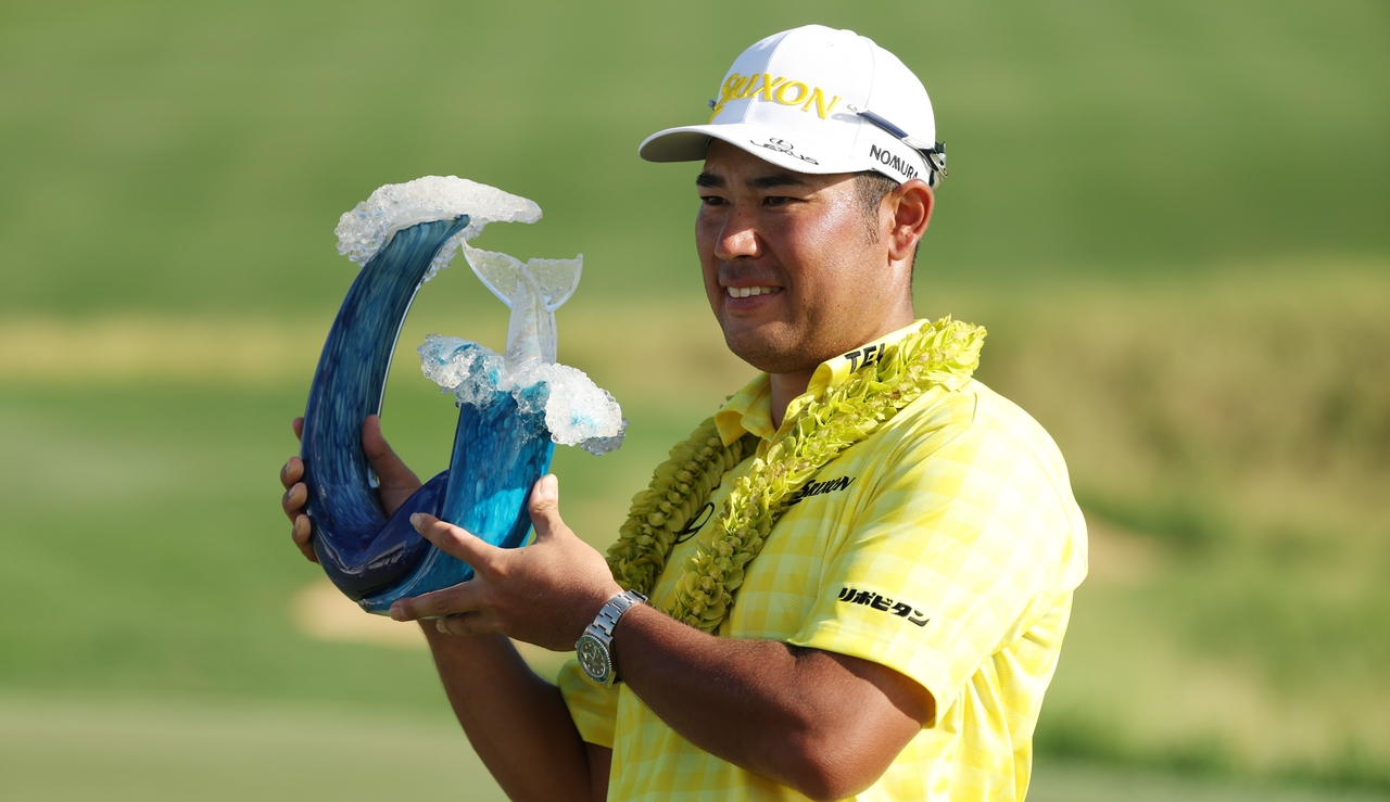 Hideki Matsuyama holds The Sentry trophy