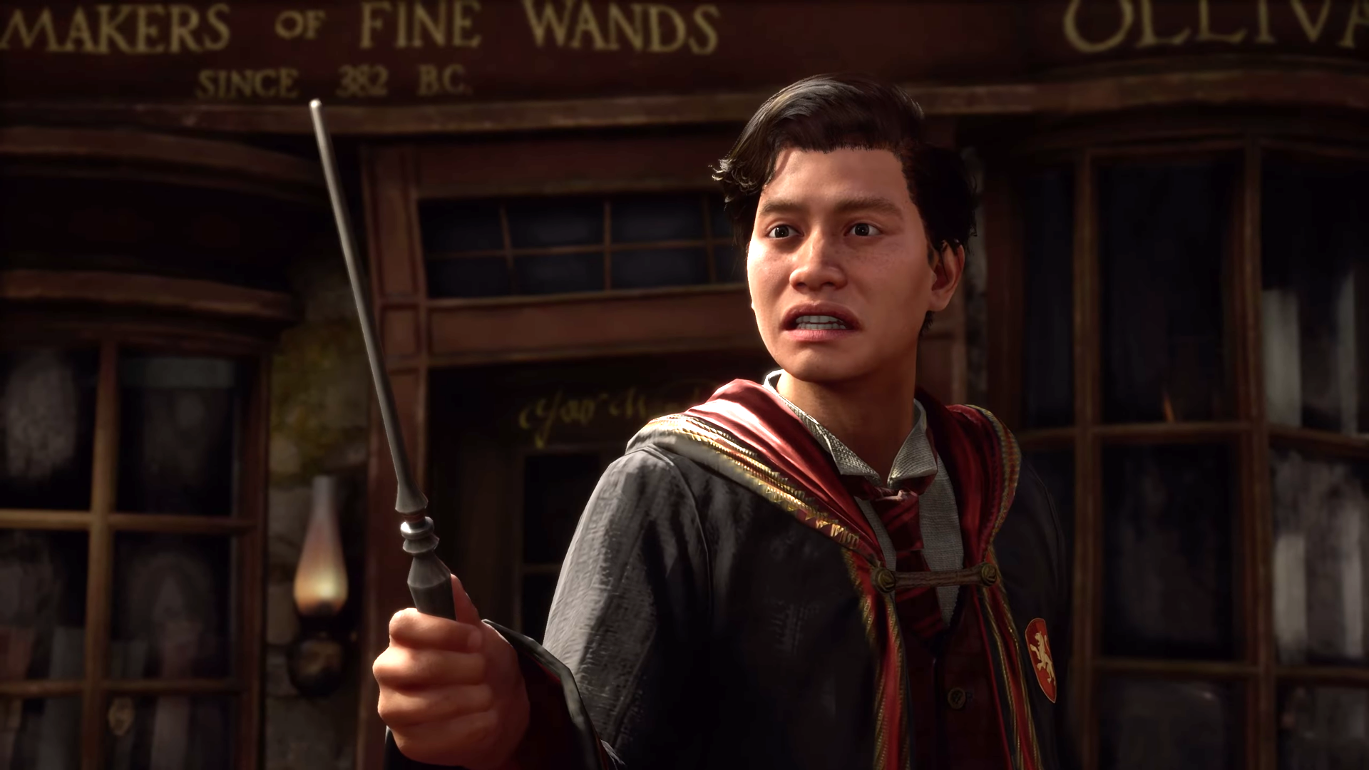 A wizard in Hogwarts Legacy holding a wand