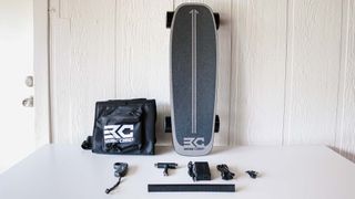 Base Camp F11 electric skateboard with accessories