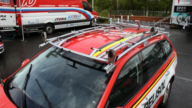 Team vehicles use custom-made roof racks that not only pack in many more bikes than what's typically available in stores but are also much faster to load and unload