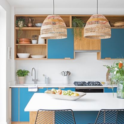 Kitchen with two woven lampshades on pendant lights above island