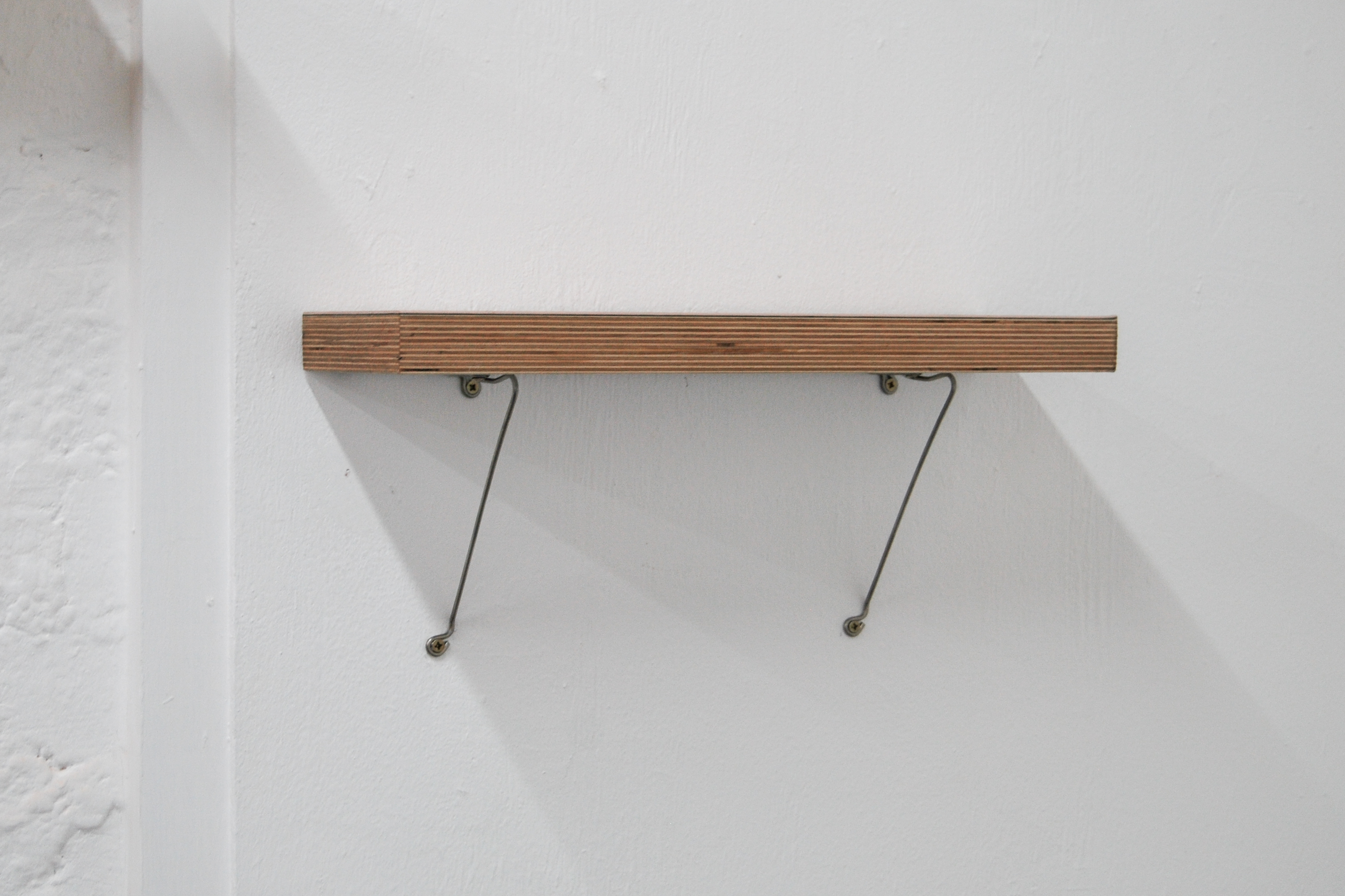 timber shelf with stainless steel bracket