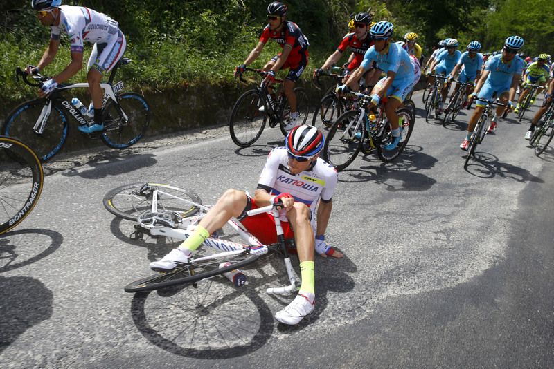 Katusha's Russian champion Alex Porsev finds himself tangled up on the ground