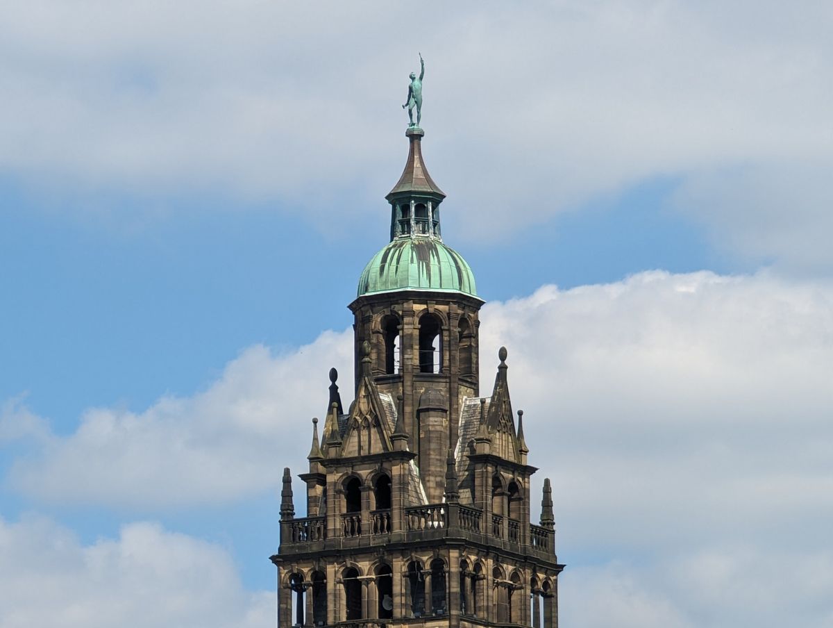 A photo of the top of a church, taken with a Moment Tele 58mm lens attached to a Google Pixel 7 Pro