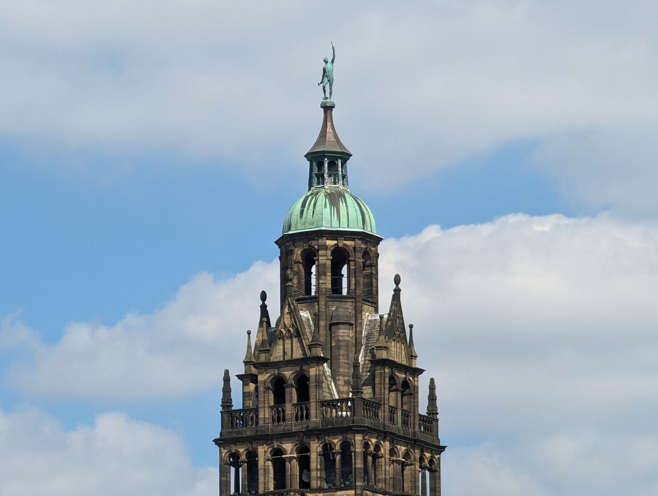 A photo of the top of a church, taken with a Moment Tele 58mm lens attached to a Google Pixel 7 Pro