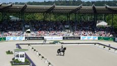Wide shot of dressage in the main stadium at Aachen