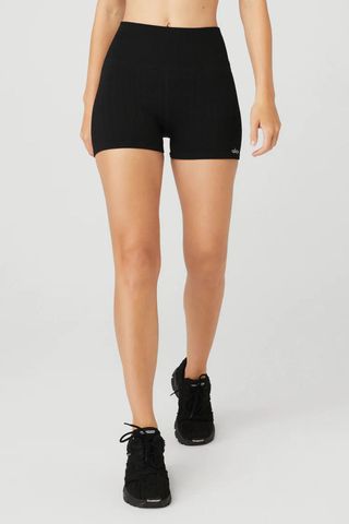 woman wearing black shorts from the alo yoga sale