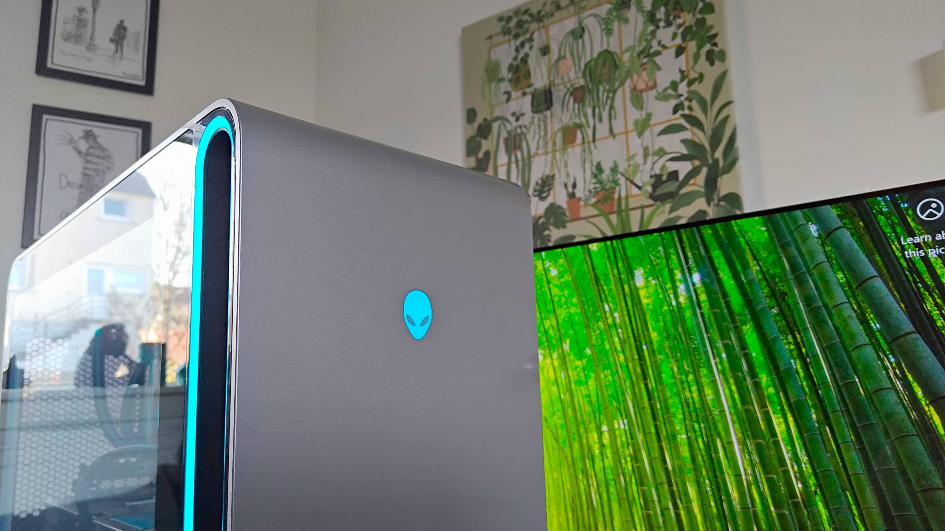 Alienware Area-51 close up of button with TV in backdrop.