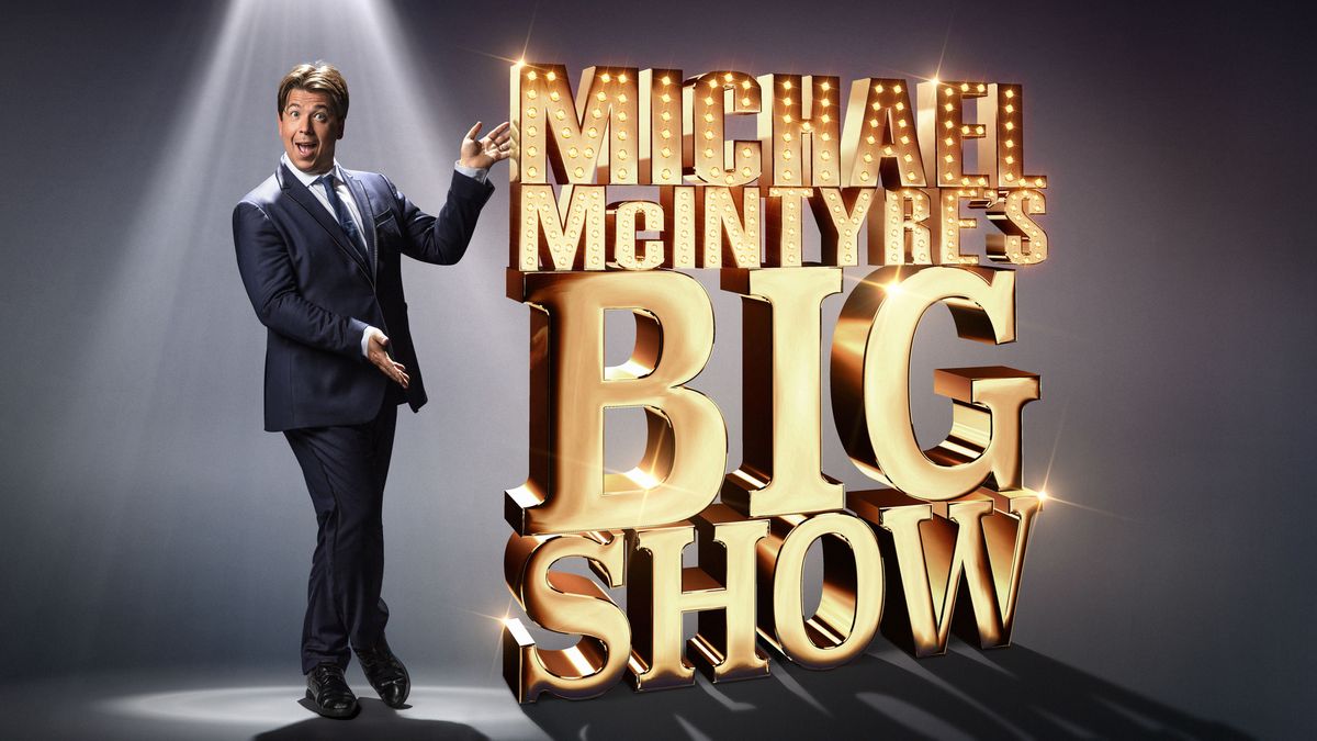 Michael McIntyre pointing to a sign saying Michael McIntyre&#039;s Big Show