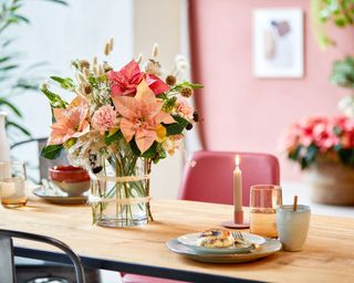 pink poinsettia vase arrangement for christmas table setting