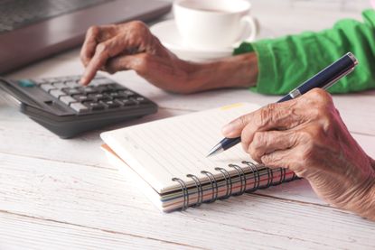 pensioner with calculator
