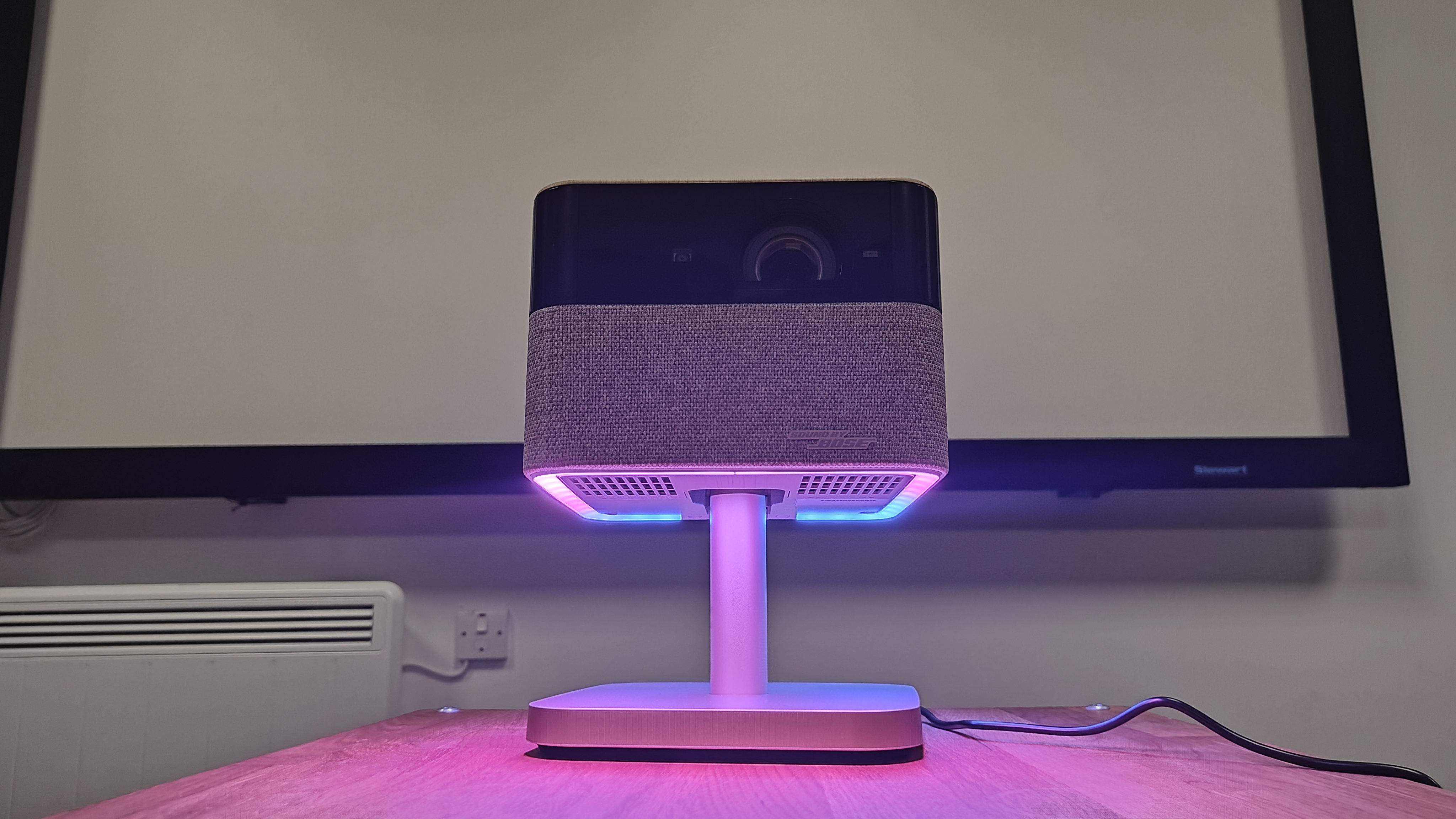 Epson EF-72 projector with a purple light display