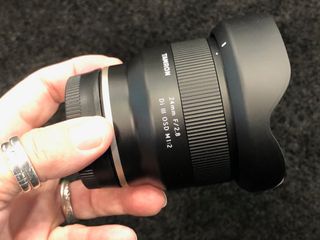 Tamron 24mm f/2.8 Di III OSD M1:2 has conventional petal-shaped lens hood