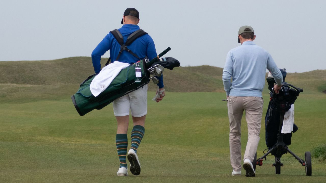 Golfers pictured walking from behind