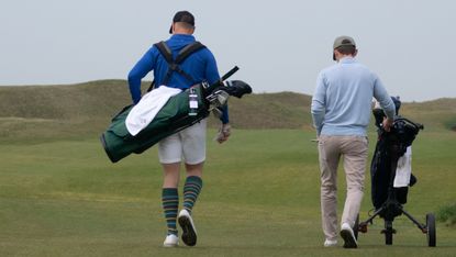 Golfers pictured walking from behind