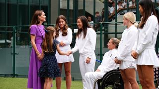 Catherine, Princess of Wales (L) and Princess Charlotte (2ndL) speak with Yuriko Lily Miyazaki (C) ahead of the Men's Singles Wimbledon final 2024