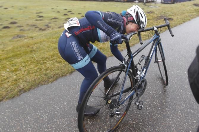 Anouska Koster (Team Futurumshop.NL) struggles with her bike after a mishap on the descent from VAM