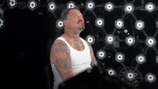 Bam Margera looks up as he sits inside a sphere of capture cameras in Tony Hawk's Pro Skater 3+4.