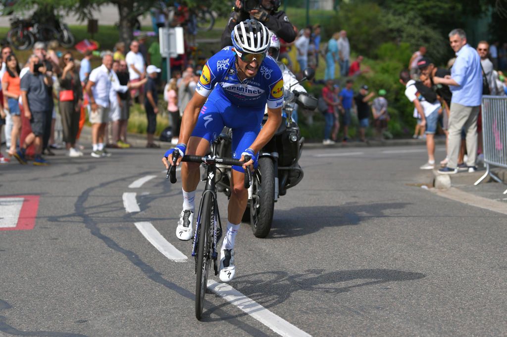 Julian Alaphilippe followed by a race motorbike