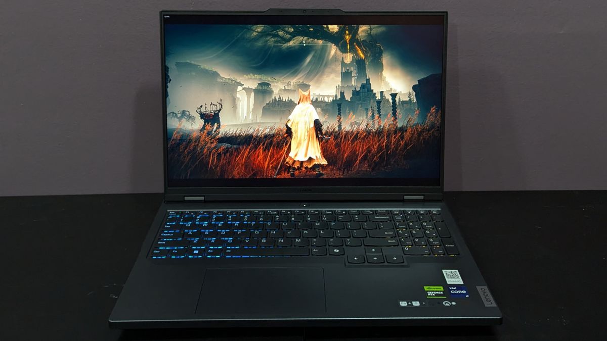 Lenovo Legion Pro 5i open on a black desk with Elden Ring on screen, highlighting the display.