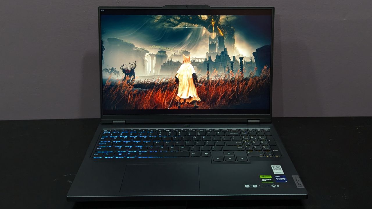 Lenovo Legion Pro 5i open on a black desk with Elden Ring on screen, highlighting the display.