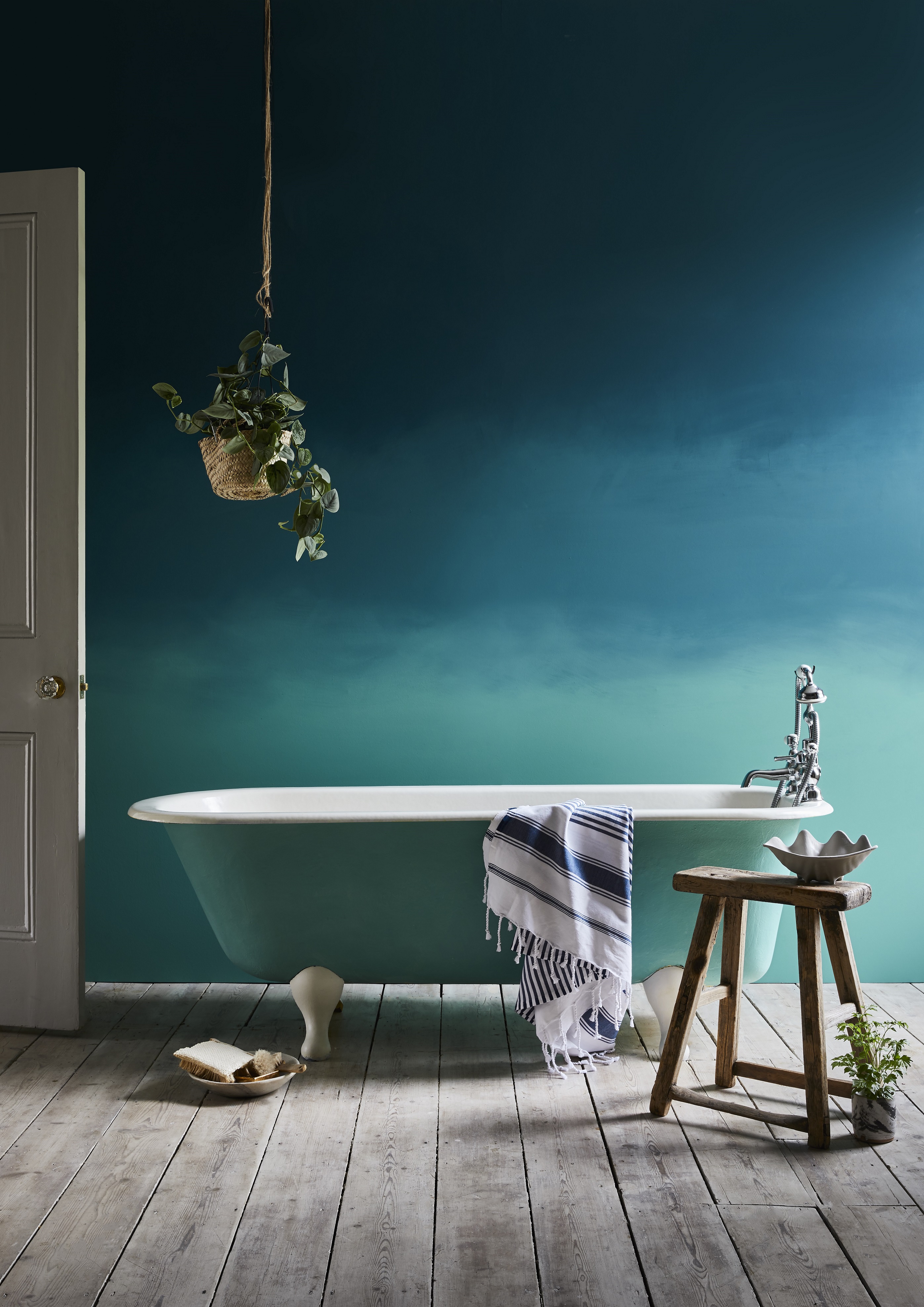 ombre finish blue toned bathroom with roller bath