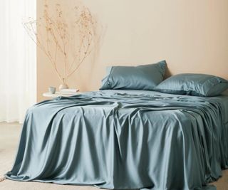 Signature Sateen Sheet Set on a bed.