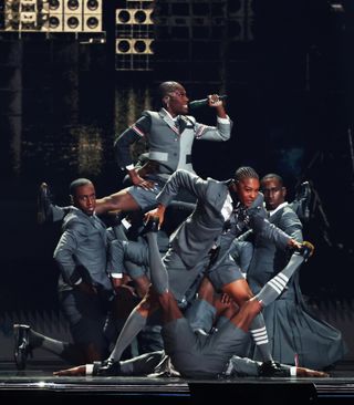 Doechii and dancers wearing Thom Browne