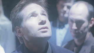 Mulder looking at a spaceship in the "Requiem" episode of The X-Files