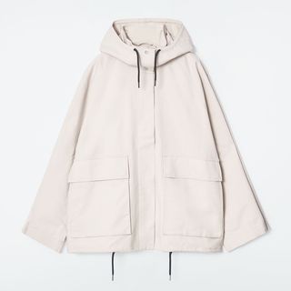 beige jacket with tall neck and hood