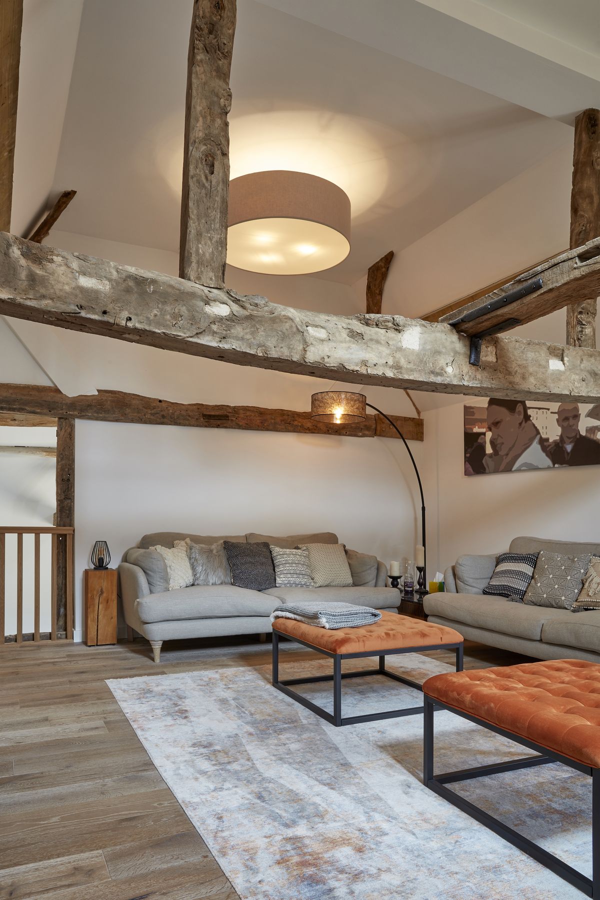 rustic living room area with exposed timber beams
