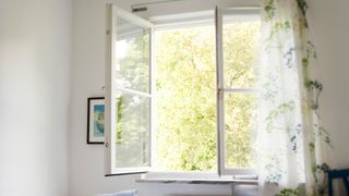 How do air purifiers work? Image of open windows getting fresh air