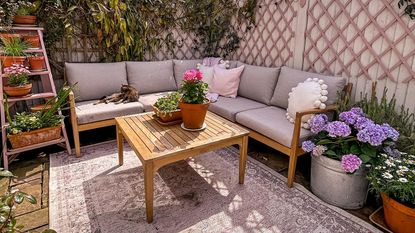 pink garden with outdoor furniture and flowers