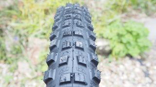 The Michelin Wild Enduro Racing Line tire on a wheel