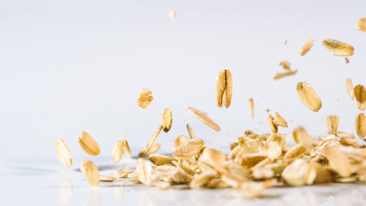 Oatmeal sprinkling against a white background