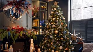 Homebase Christmas tree in a modern living room decorated in a blue and gold Christmas tree color trend