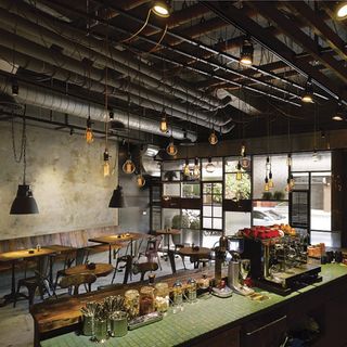 restaurants with mismatched wooden door and hanging light