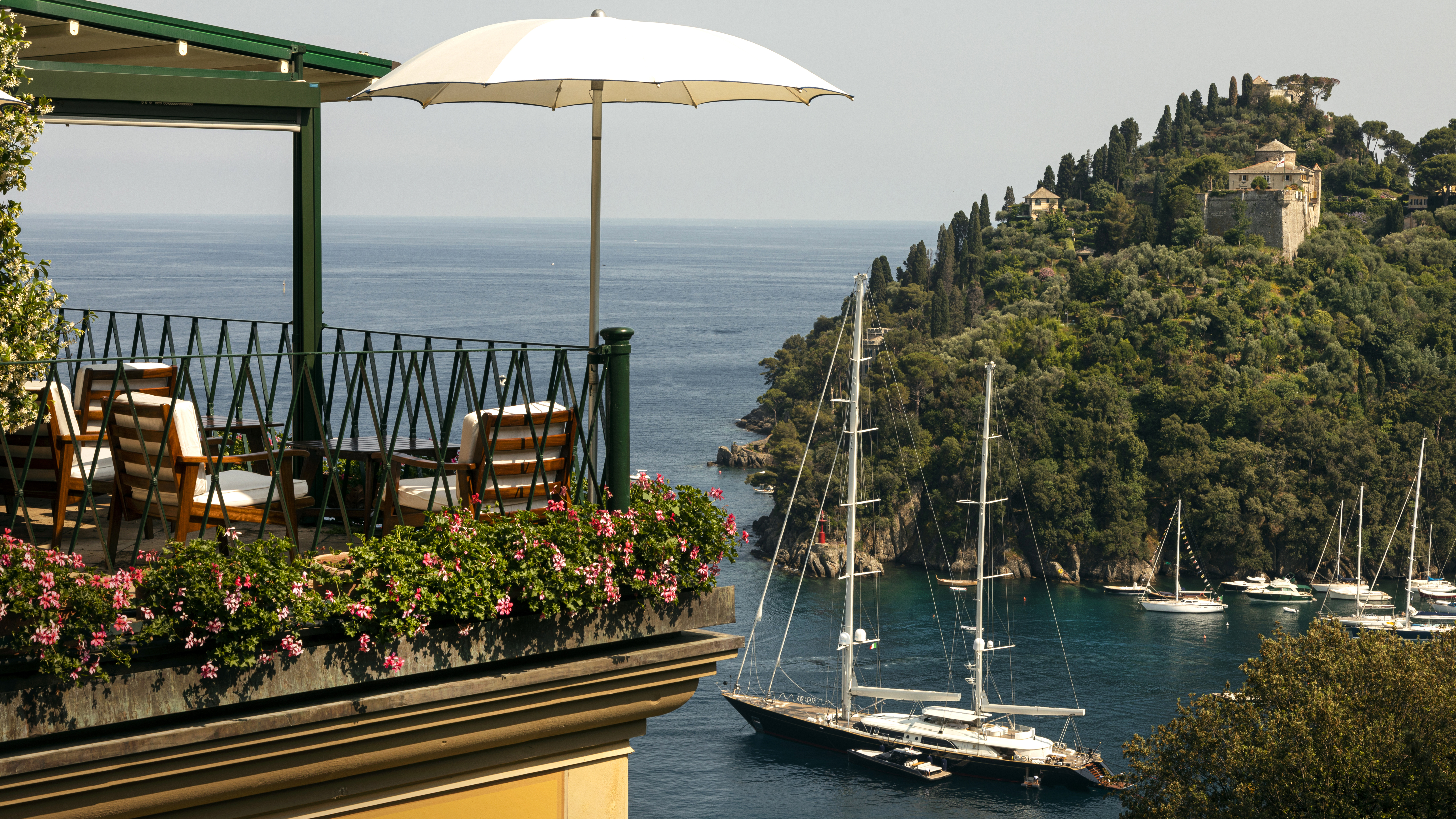 The view from a luxury hotel in Italy of a sailing yacht