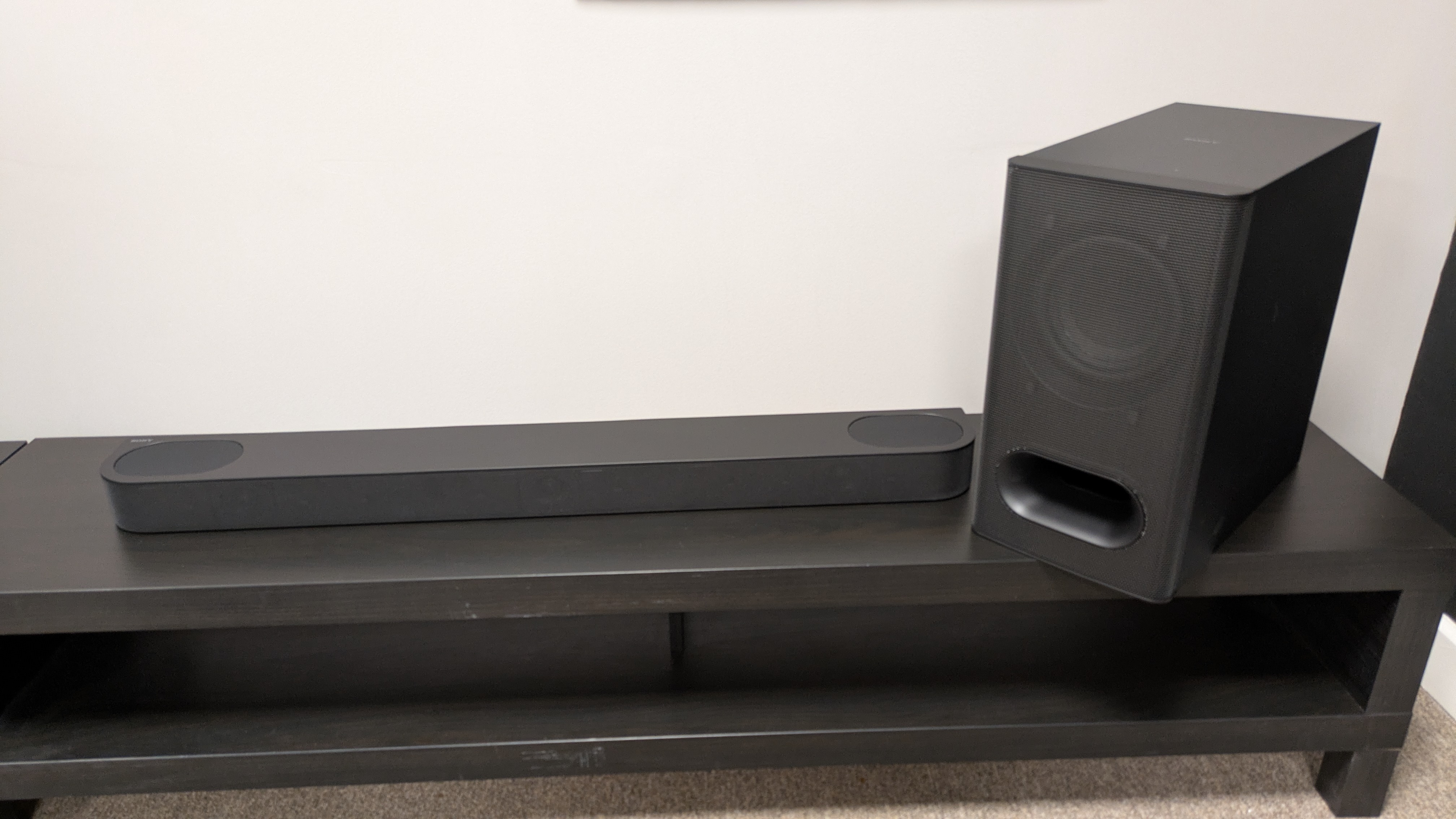 Sony Bravia Theater Bar 6 on dark wood stand