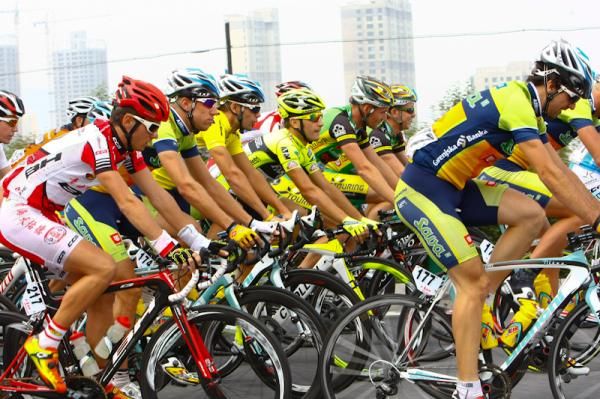 Yellow jersey holder,Luca Mezgec chatting with Andrea Guardidini before zero kilometer