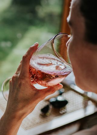 Woman having a glass of sparkling wine