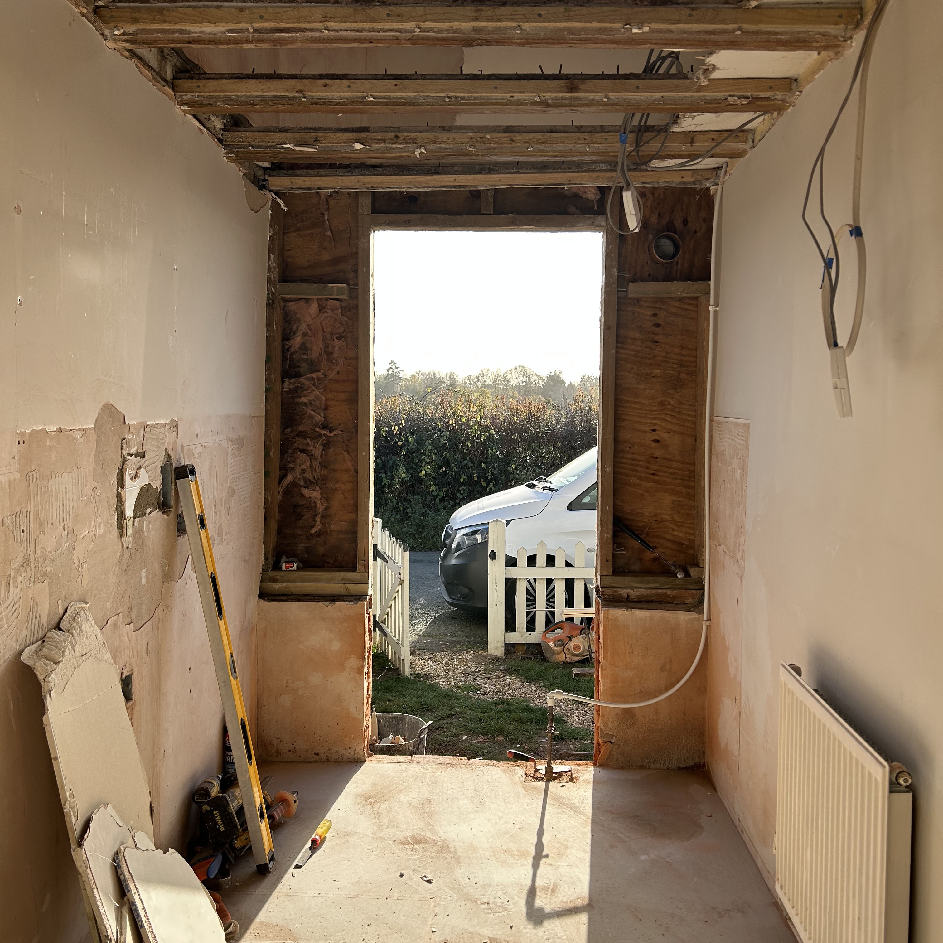 a hallway stripped back mid renovation