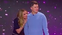 Scarlett Johansson leaning on husband Colin Jost's shoulder while they are playing a game on The TODAY Show.