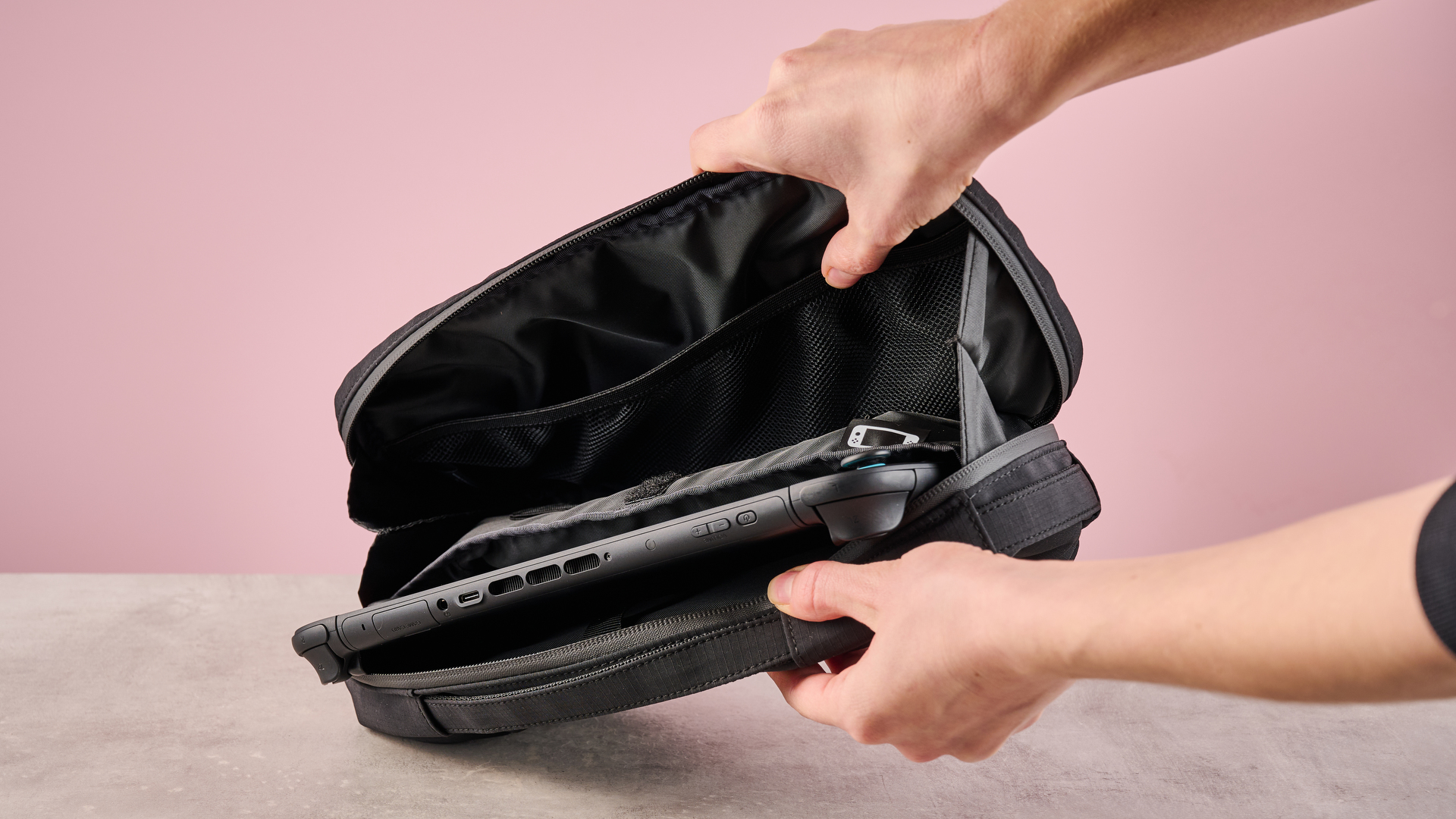 Person opening up the Hori Puff Pouch for Nintendo Switch 2