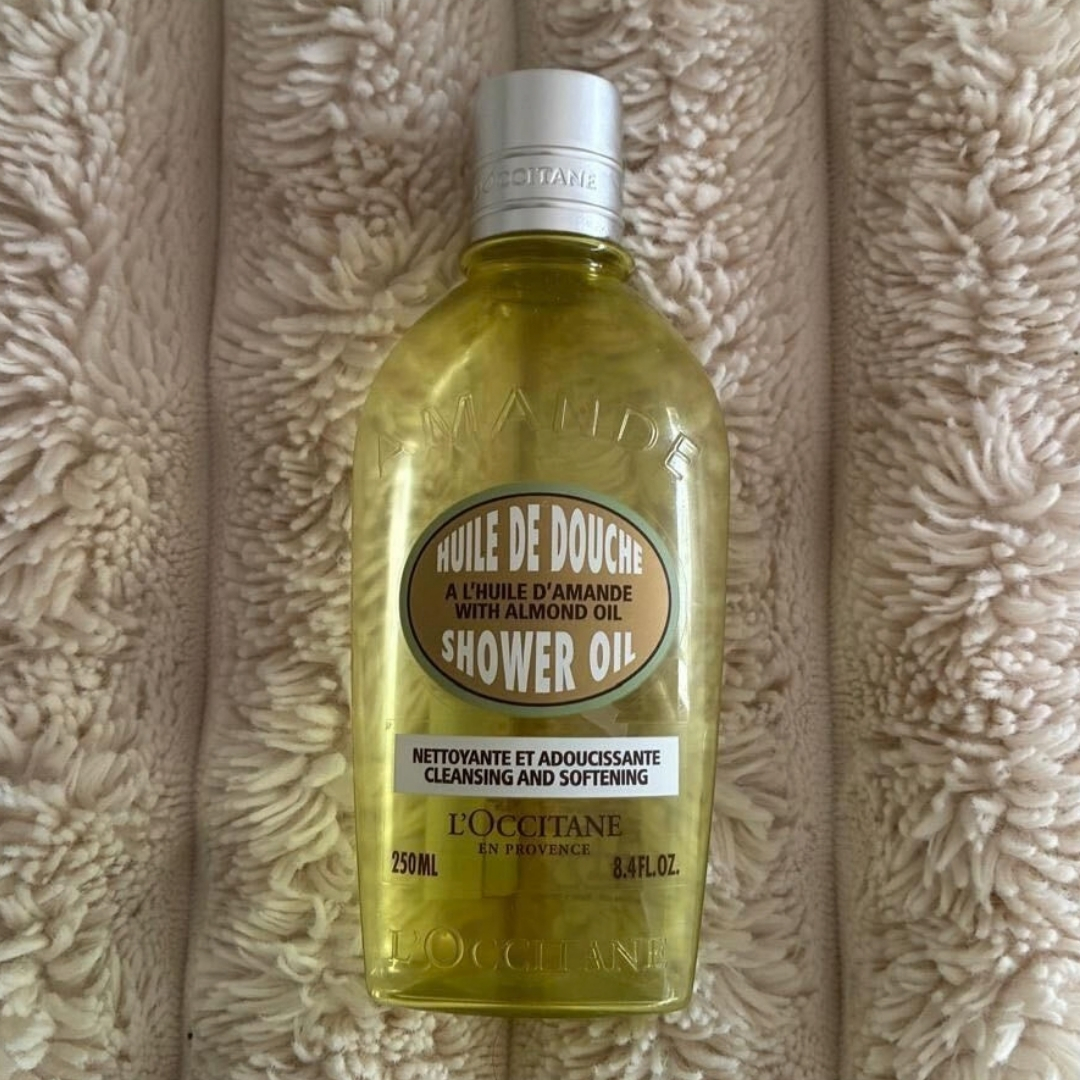 Empty bottle of L'Occitane Almond Shower Oil 250ml