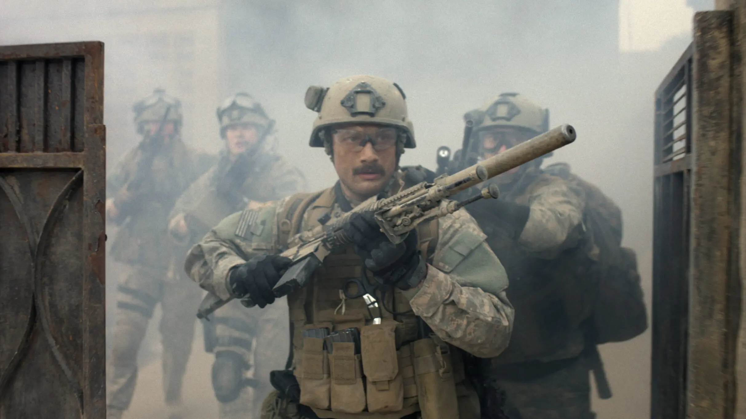 A movie still from Warfare showing army soldiers holding guns