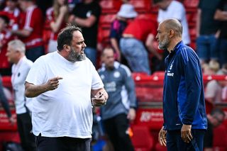 Nottingham Forest's Portuguese manager Nuno Espirito Santo (R) speaks with Nottingham Forest's Greek co-owner Evangelos Marinakis (L) at the end of the English Premier League football match between Nottingham Forest and Leicester City at The City Ground in Nottingham, central England, on May 11, 2025. Nottingham Forest and Leicester City equalise 2 - 2.